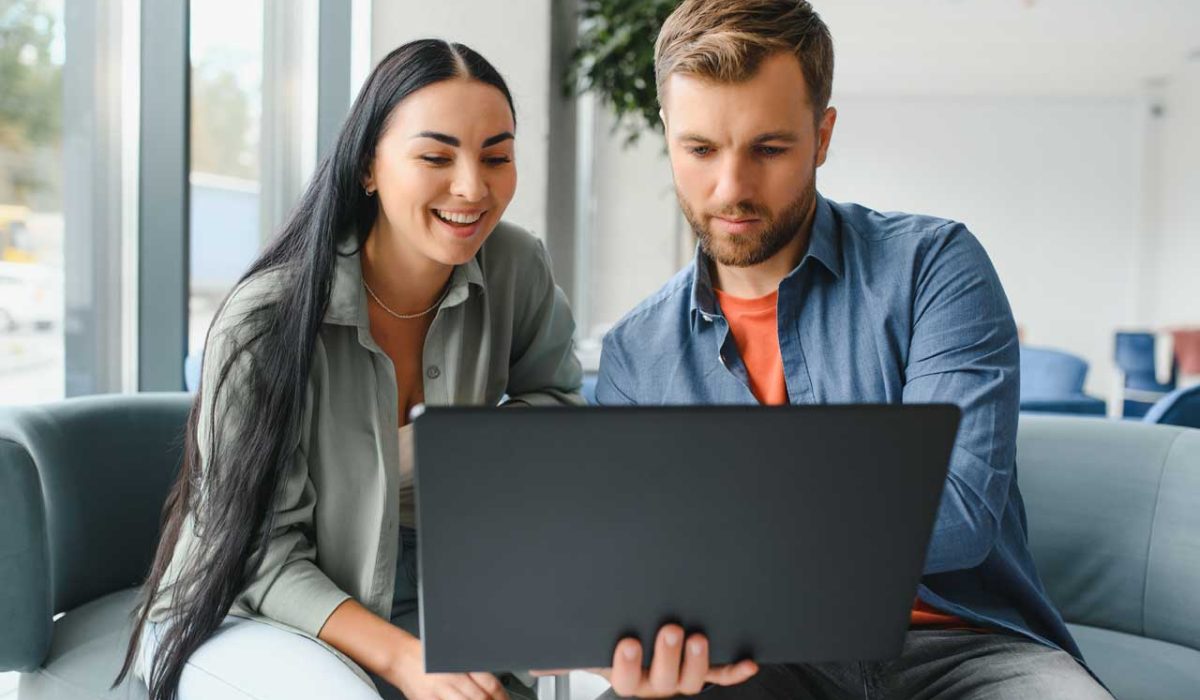 Couple looking at their mortgage options on their laptop